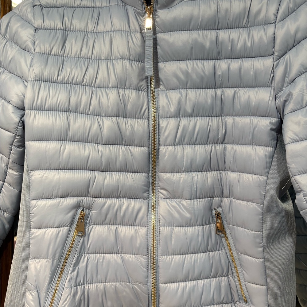 Pretty blue light jacket size large. Never worn